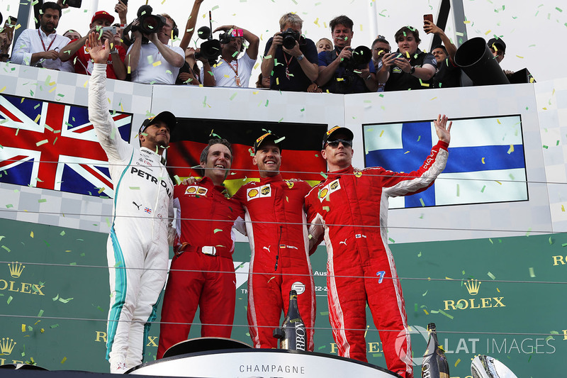 Podyum: 2. sıra Lewis Hamilton, Mercedes AMG F1, yarış galibi Sebastian Vettel, Ferrari, 3. sıra Kimi Raikkonen, Ferrari