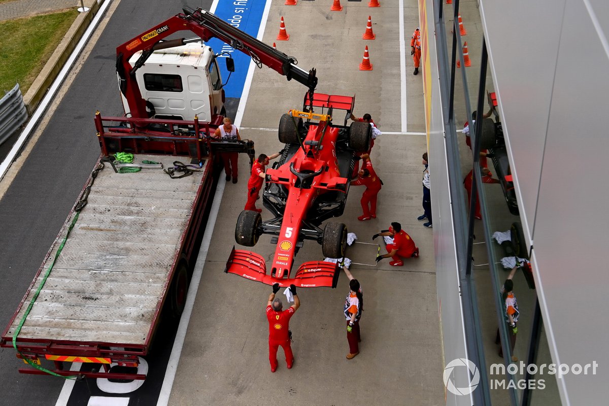 The car of Sebastian Vettel, Ferrari SF1000, is loaded onto a truck after a technical failure