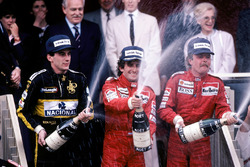 Podium: race winner Alain Prost, McLaren, second place Keke Rosberg, McLaren, third place Ayrton Senna, Lotus