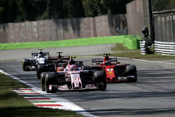 Kimi Raikkonen, Ferrari SF70H battles for position, Esteban Ocon, Sahara Force India VJM10