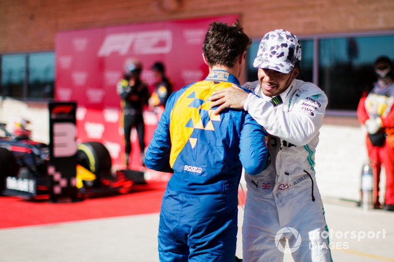 Lando Norris, McLaren, congratulates Lewis Hamilton, Mercedes AMG F1, 2nd position, on securing his sixth world title