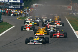 Start: Nigel Mansell, Williams FW11B Honda; Gerhard Berger, Ferrari F187; Ayrton Senna, Lotus 99T Ho