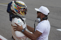 Lewis Hamilton, Mercedes AMG F1, celebrates with his brother Nicolas Hamilton, after securing pole p