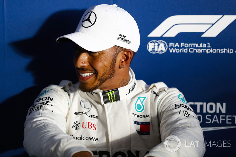 Lewis Hamilton, Mercedes AMG F1, relaxes after setting pole position