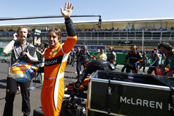 Fernando Alonso, McLaren, waves to fans