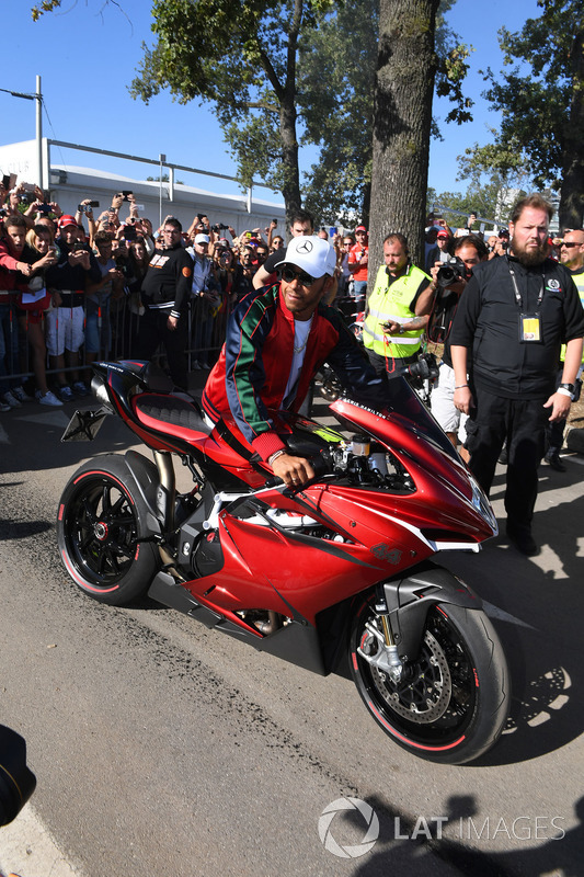Lewis Hamilton, Mercedes AMG F1 arrives at the track on his motorbike
