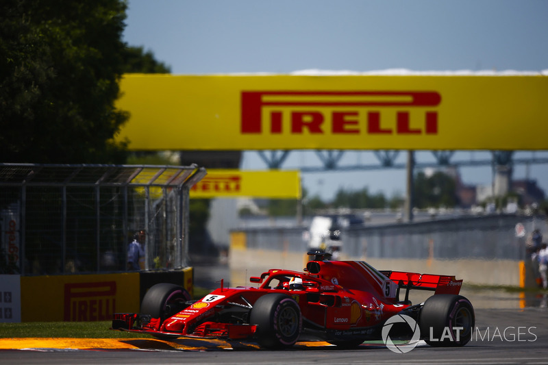 Sebastian Vettel, Ferrari SF71H, bounces over a kerb