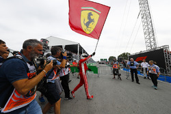 Sebastian Vettel, Ferrari, celebrates victory by waving a Prancing Horse flag