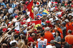 Fernando Alonso, McLaren, signs autographs for fans