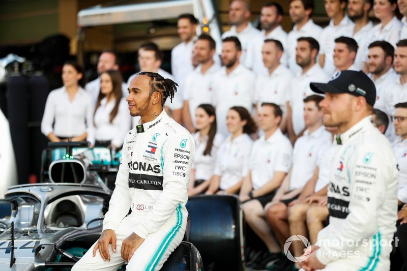 Lewis Hamilton, Mercedes AMG F1, poses for a group photo alongside Valtteri Bottas, Mercedes AMG F1