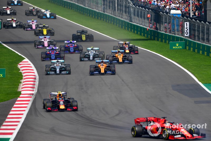 Sebastian Vettel, Ferrari SF90, leads Alex Albon, Red Bull RB15, Carlos Sainz Jr., McLaren MCL34, Lewis Hamilton, Mercedes AMG F1 W10, Lando Norris, McLaren MCL34, Valtteri Bottas, Mercedes AMG W10, and the remainder of the field at the start