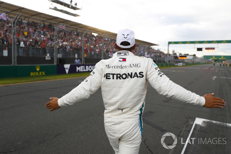 Lewis Hamilton, Mercedes AMG F1, celebrates taking pole position alongside on the pit straight