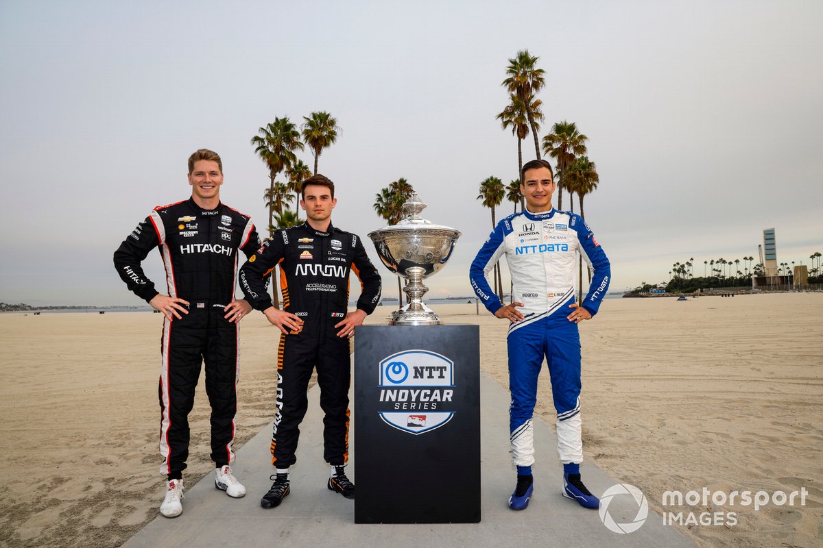 Championship contenders Josef Newgarden, Team Penske Chevrolet, Patricio O'Ward, Arrow McLaren SP Chevrolet., Alex Palou, Chip Ganassi Racing Honda with the Astor Cup trophy