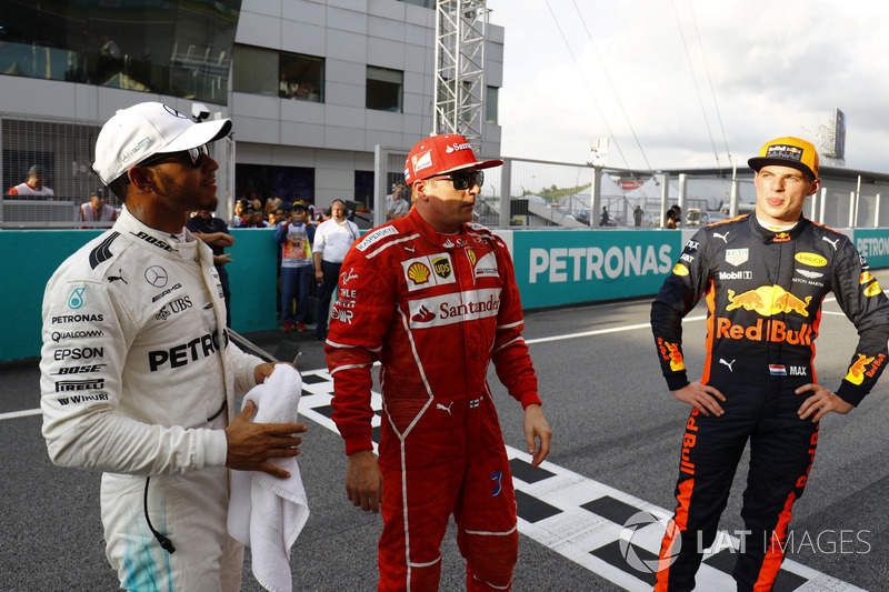 The top-three qualifiers. Pole winner Lewis Hamilton, Mercedes AMG F1, Kimi Raikkonen, Ferrari, Max Verstappen, Red Bull Racing