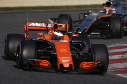 Stoffel Vandoorne, McLaren MCL32, leads Esteban Ocon, Force India VJM10