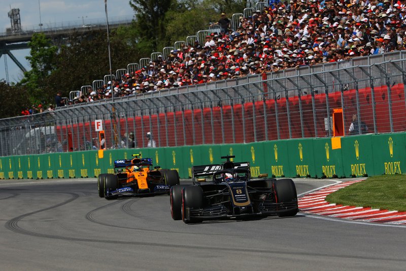 Romain Grosjean, Haas VF-19, leads Lando Norris, McLaren MCL34
