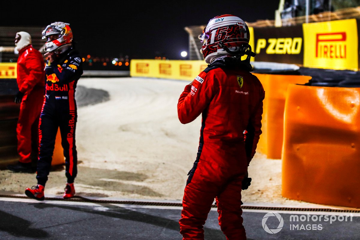 Max Verstappen, Red Bull Racing, Charles Leclerc, Ferrari, at the side of the track after retiring