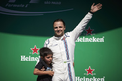 Felipe Massa, Williams, with his son Felipinho waves to his home fans from the podium after his fina