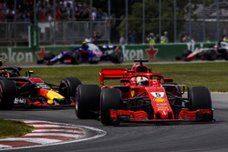 Sebastian Vettel, Ferrari SF71H, leads Max Verstappen, Red Bull Racing RB14