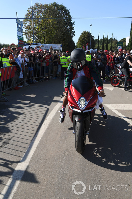 Lewis Hamilton, Mercedes AMG F1 arrives at the track on his motorbike