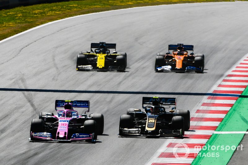 Lance Stroll, Racing Point RP19, leads Kevin Magnussen, Haas F1 Team VF-19, Daniel Ricciardo, Renault F1 Team R.S.19, and Carlos Sainz Jr., McLaren MCL34