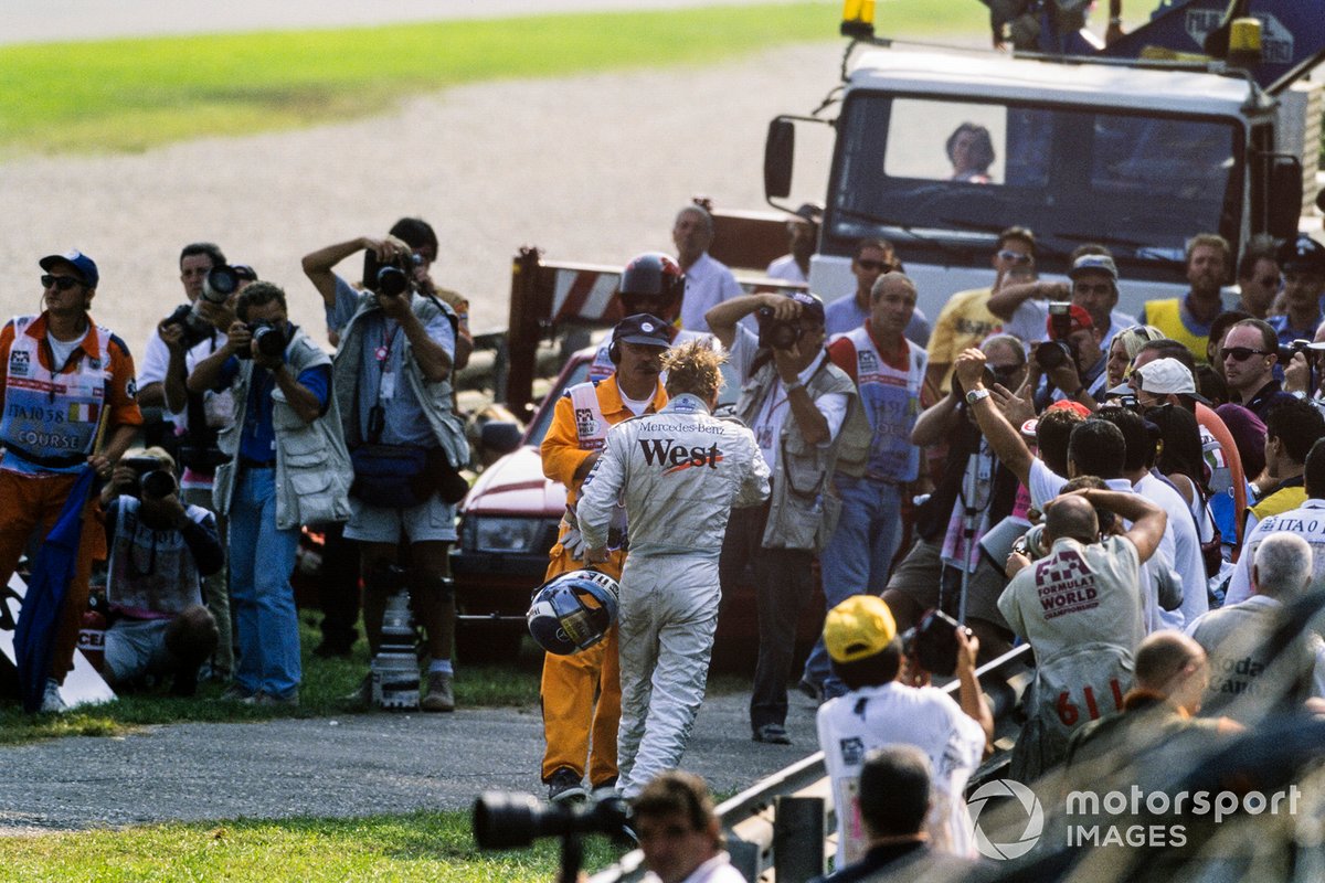 Mika Hakkinen, McLaren MP4/14-Mercedes, walks away from his car