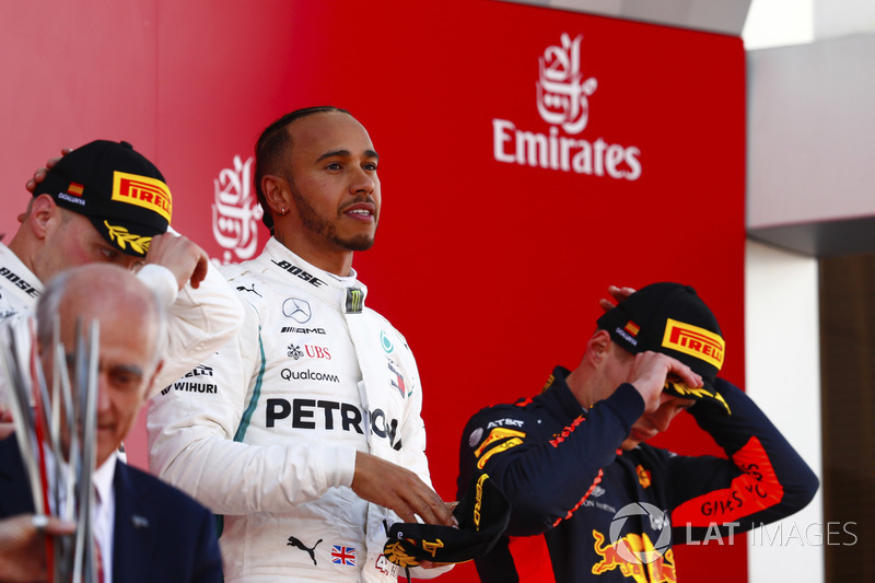 Lewis Hamilton, Mercedes AMG F1, celebrates victory on the podium with Valtteri Bottas, Mercedes AMG F1 and Max Verstappen, Red Bull Racing