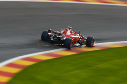 Sparks fly from the car of Sebastian Vettel, Ferrari SF70H