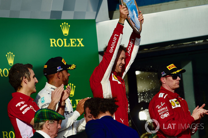 Podyum: 2. sıra Lewis Hamilton, Mercedes AMG F1, yarış galibi Sebastian Vettel, Ferrari, 3. sıra Kimi Raikkonen, Ferrari