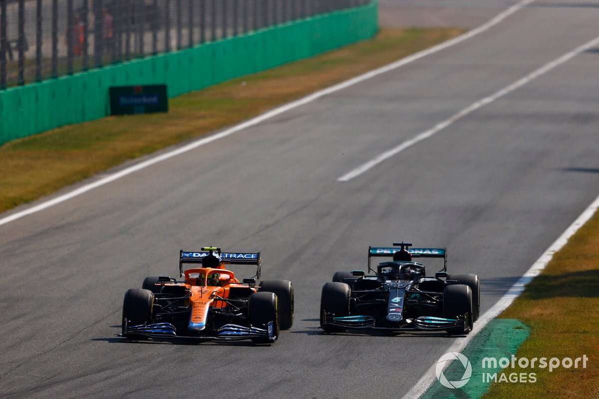 Lando Norris, McLaren MCL35M, battles with Lewis Hamilton, Mercedes W12