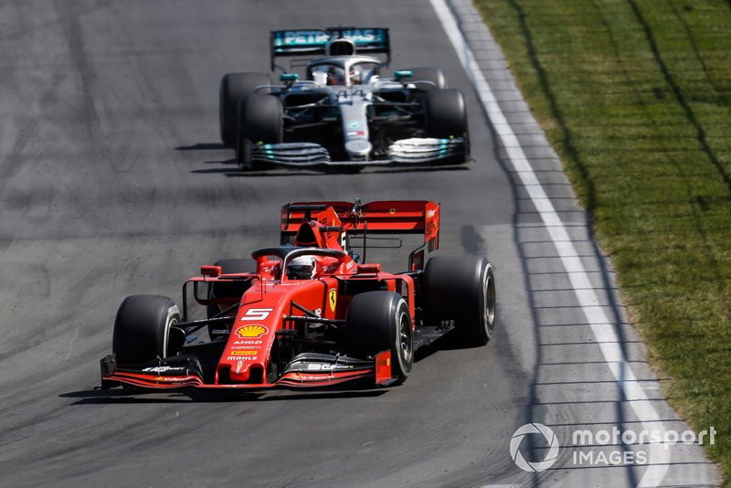 Sebastian Vettel, Ferrari SF90, leads Lewis Hamilton, Mercedes AMG F1 W10