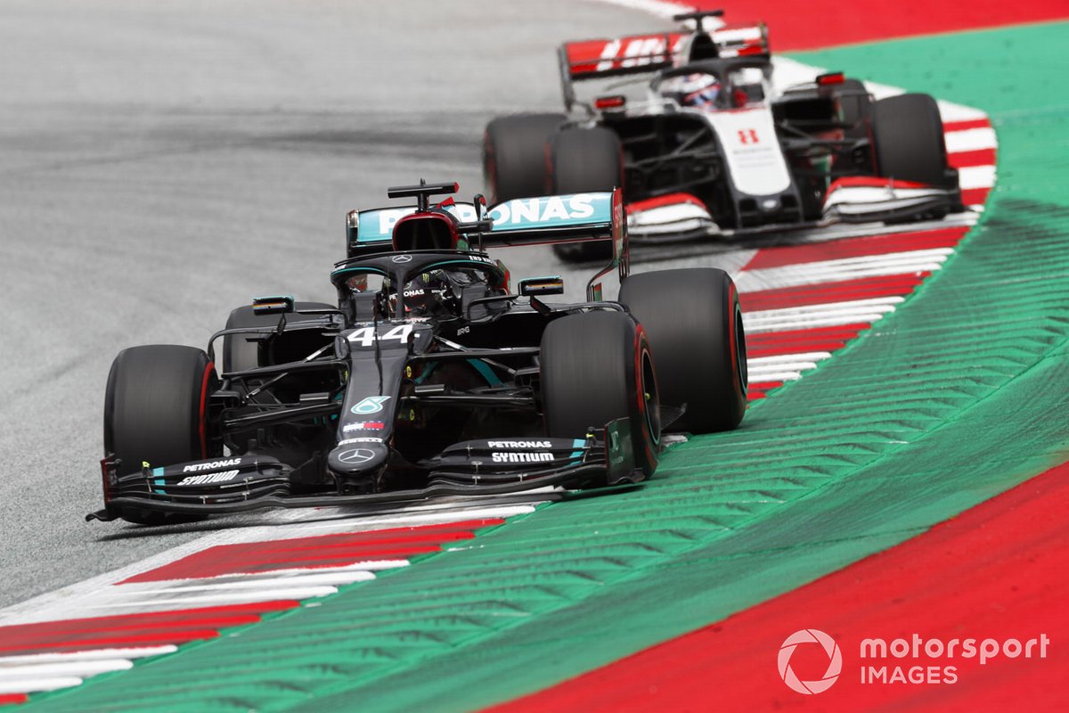 Lewis Hamilton, Mercedes F1 W11 EQ Performance, leads Romain Grosjean, Haas VF-20