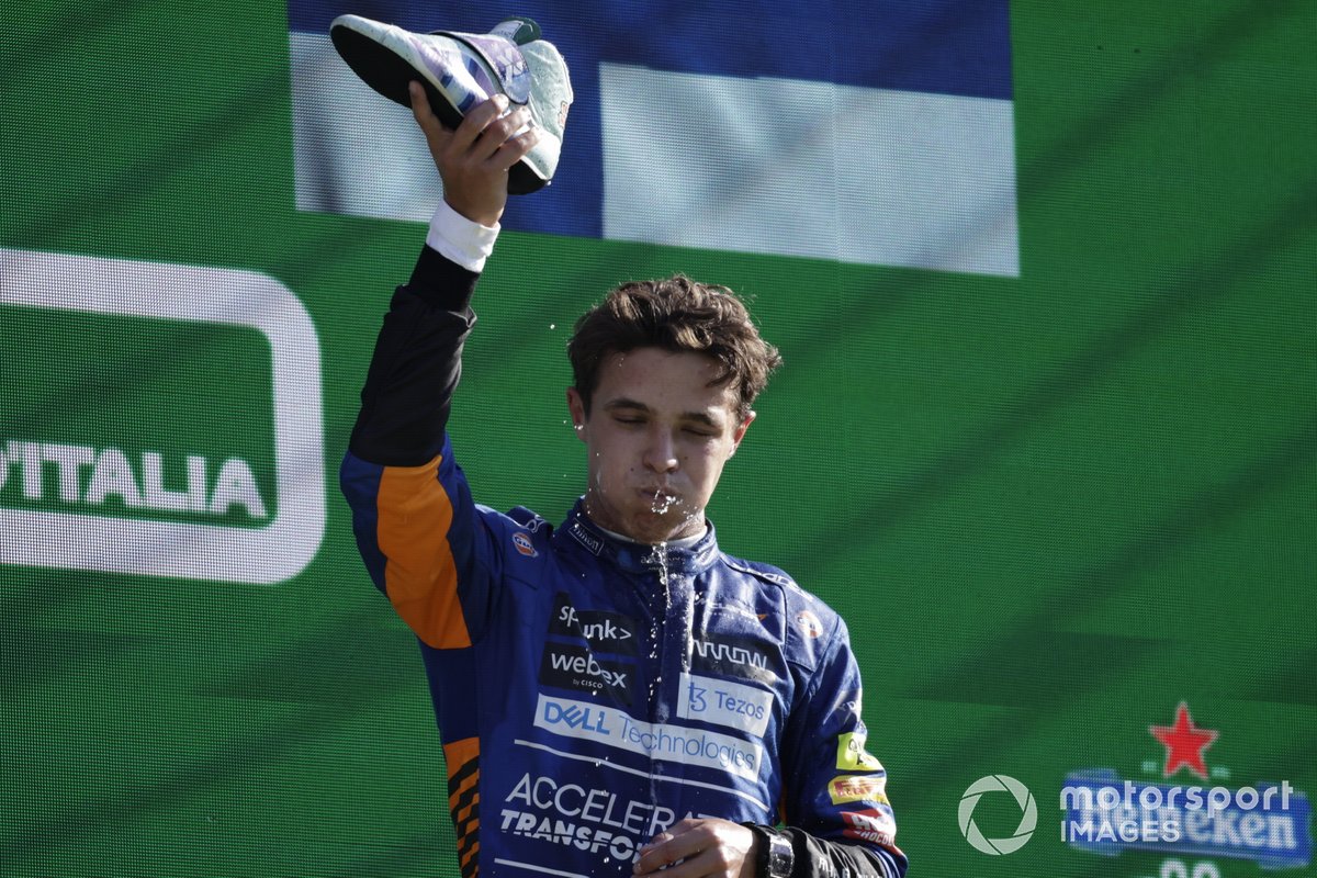 Lando Norris, McLaren, 2nd position, performs a shoey on the podium