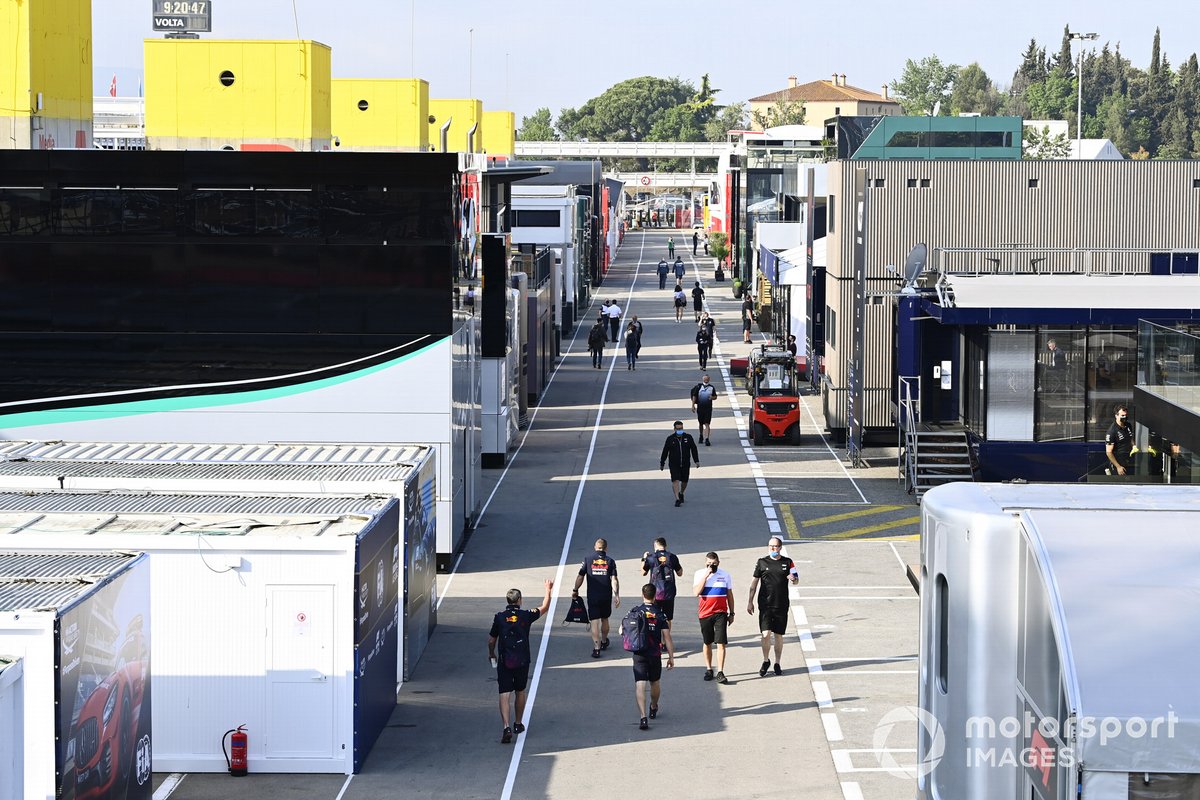 Team personnel arrive in the paddock