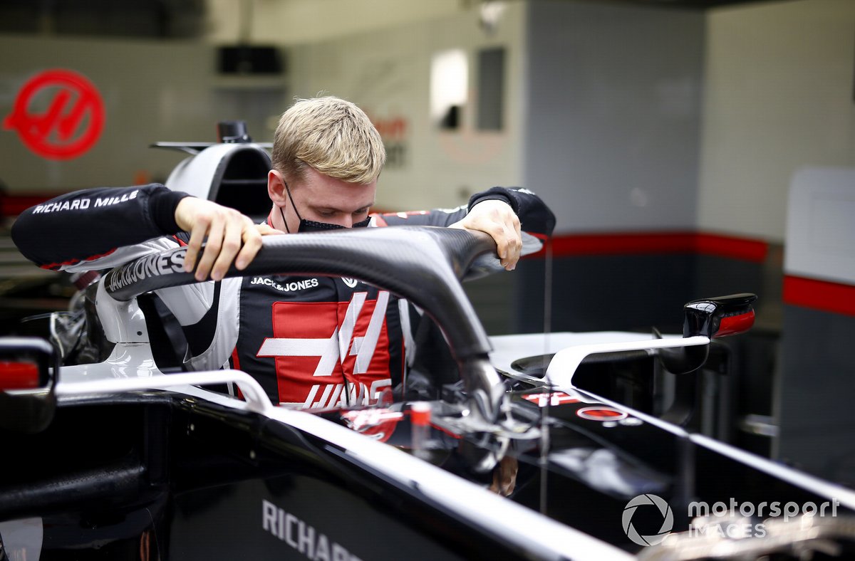 Mick Schumacher sits in his Haas VF-20 for his seat fitting.