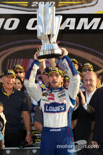 Championship victory lane: NASCAR Sprint Cup Series 2010 champion Jimmie Johnson, Hendrick Motorsports Chevrolet accepts the Sprint Cup for a fifth consecutive time