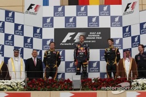 2nd place Kimi Raikkonen, Lotus Renault F1 Team with 1st place Sebastian Vettel, Red Bull Racing and 3rd place Romain Grosjean, Lotus Renault F1 Team