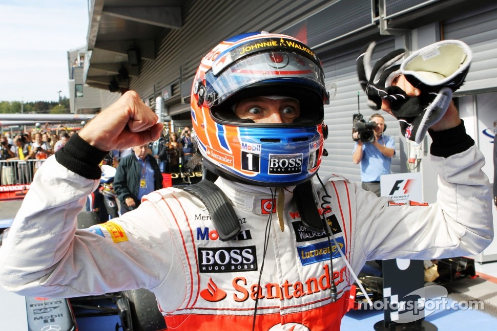 Race winner Jenson Button celebrates