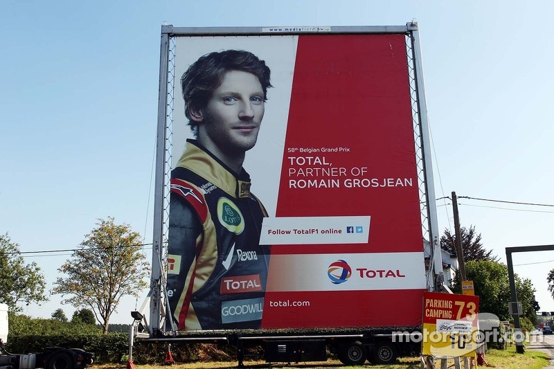 f1-belgian-gp-2013-total-advertising-hoarding-with-romain-grosjean-lotus-f1-team.jpg