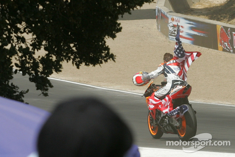 Race winner Nicky Hayden celebrates