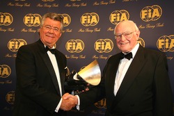 Professor Sid Watkins presents the FIA InstituteCentre of Excellence trophy to Philippe Gurdjian