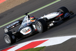 Zak Brown in een klassieke McLaren