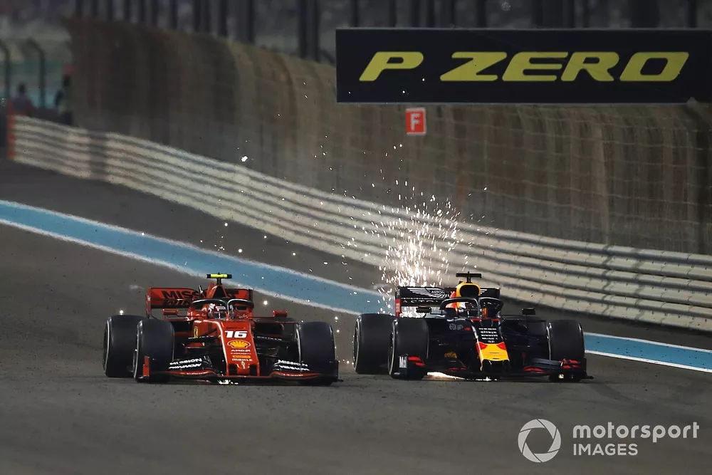 Max Verstappen, Red Bull Racing RB15, battles with Charles Leclerc, Ferrari SF90