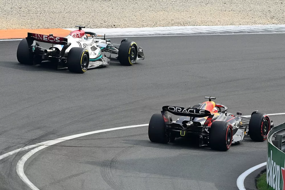 George Russell, Mercedes W13, passes Max Verstappen, Red Bull Racing RB18