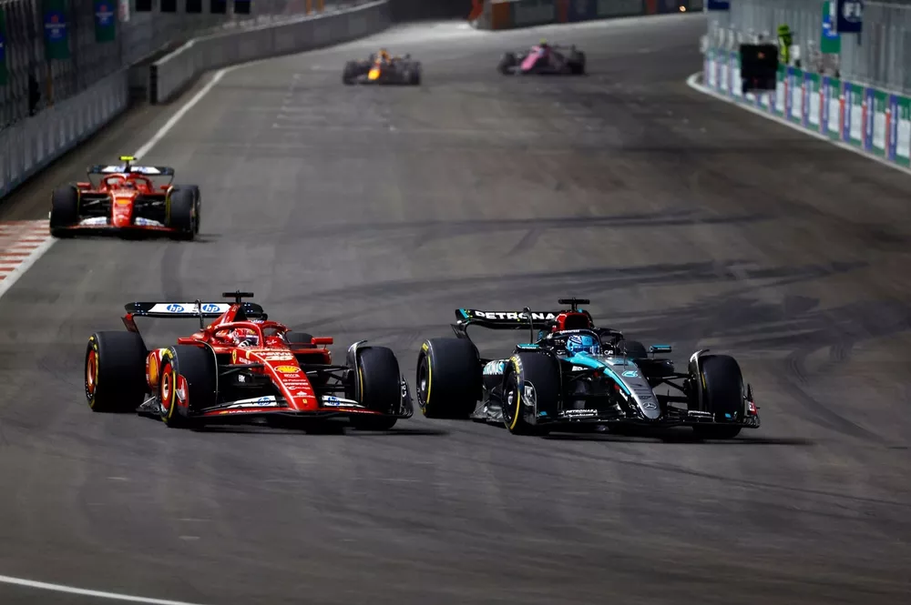 Charles Leclerc, Ferrari SF-24 battles with George Russell, Mercedes F1 W15 
