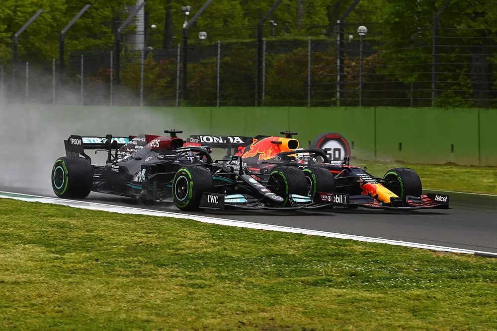 Lewis Hamilton, Mercedes W12, battles with Max Verstappen, Red Bull Racing RB16B 