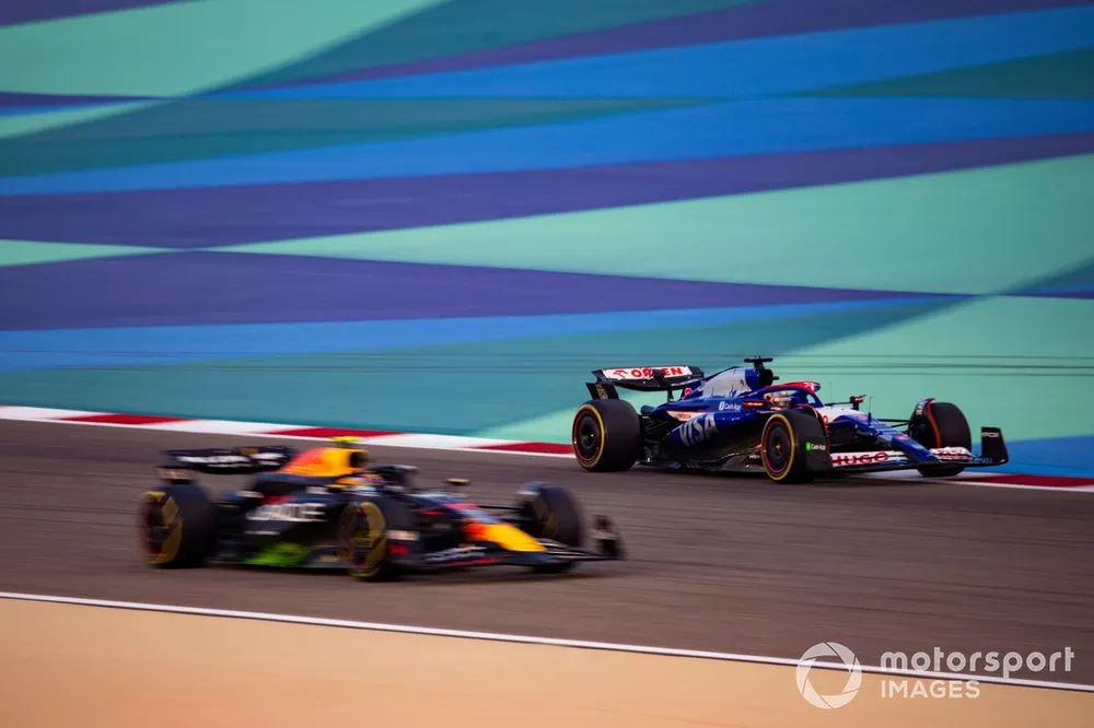Sergio Perez, Red Bull Racing RB20, and Daniel Ricciardo, VCARB 01