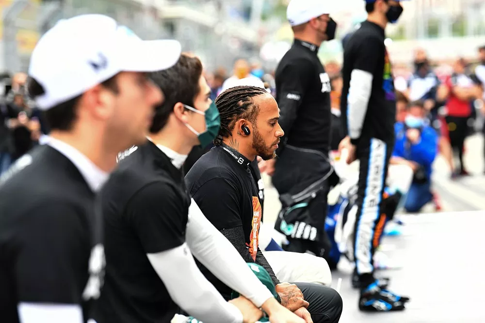 Lance Stroll, Aston Martin,Lewis Hamilton, Mercedes, Valtteri Bottas, Mercedes, and others stand and kneel in support of the End Racism campaign prior to the start