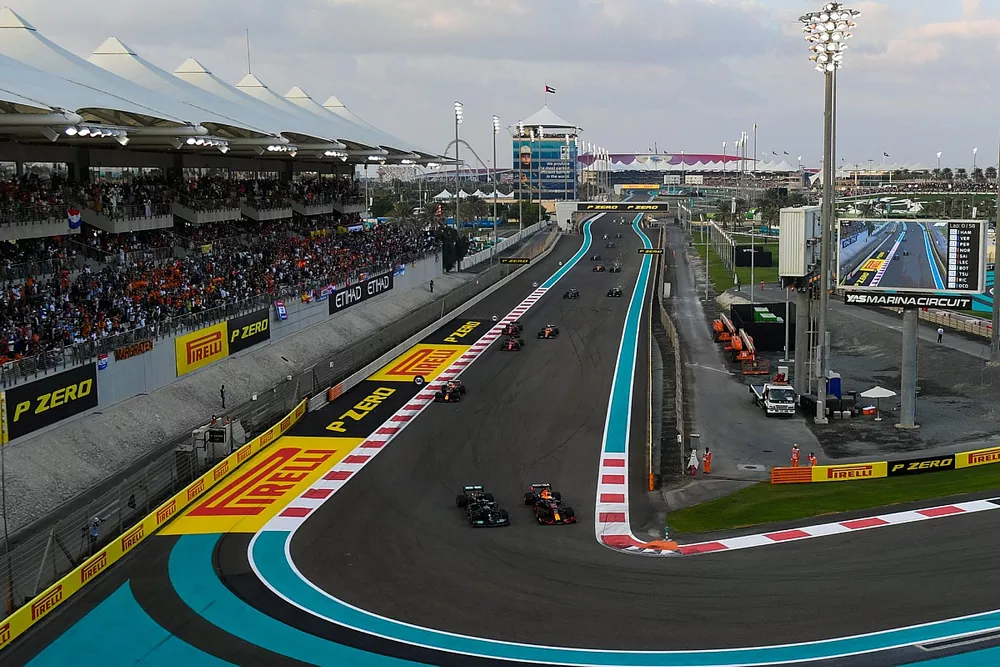 Max Verstappen, Red Bull Racing RB16B, battles with Lewis Hamilton, Mercedes W12, on the opening lap