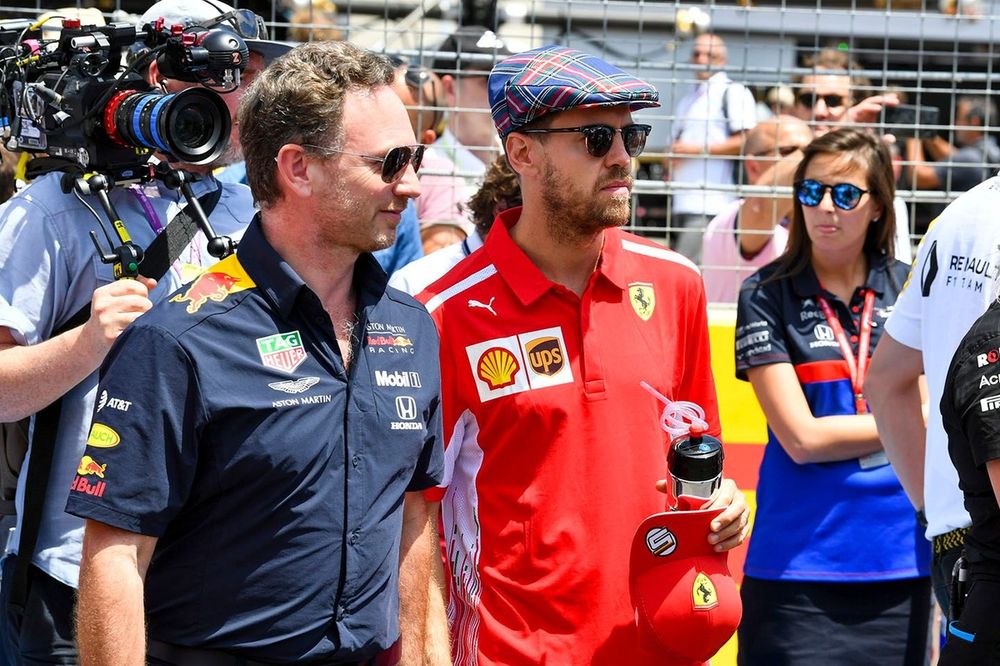Christian Horner, Team Principal, Red Bull Racing, with Sebastian Vettel, Ferrari